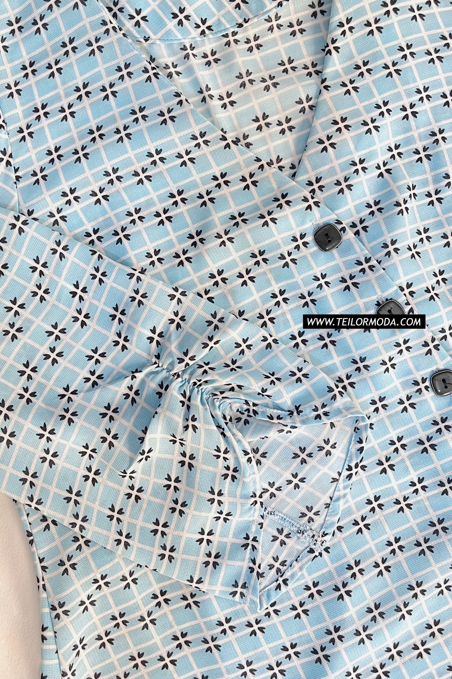 BLUSA ASIMÉTRICA ESTAMPADA ROUSE CELESTE